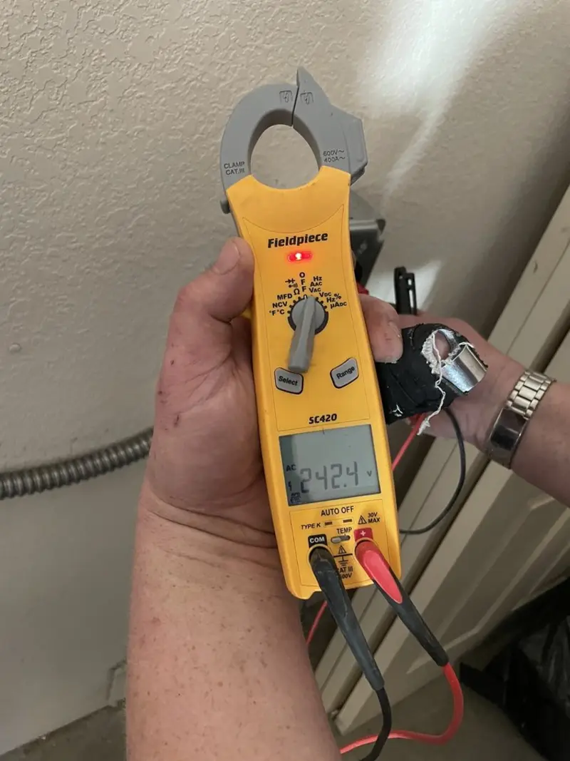Voltage testing with clamp meter during Circuit Breaker Repair in Burrell